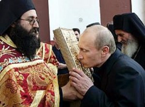 Russian President Vladimir Putin kisses an icon while visiting the Mount Athos monastic community in northern Greece, during a visit, Friday, Sept. 9 2005. Putin made a private pilgrimage Friday to the 1,000-year-old monastic community of Mount Athos, the first Russian head of state ever to set foot in a place regarded as the cradle of Orthodox Christianity. (AP Photo/ITAR-TASS, Presidential Press Service, Vladimir Rodionov)